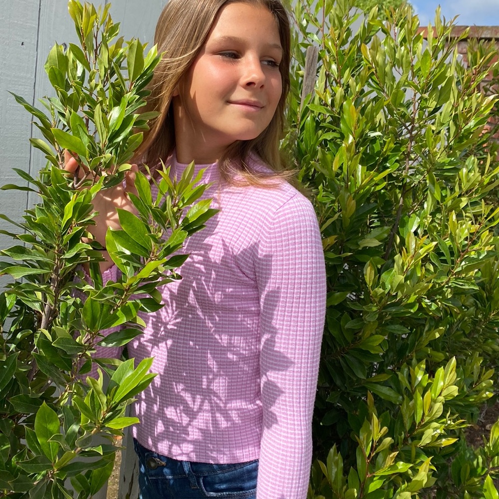 Pink and white striped turtleneck.